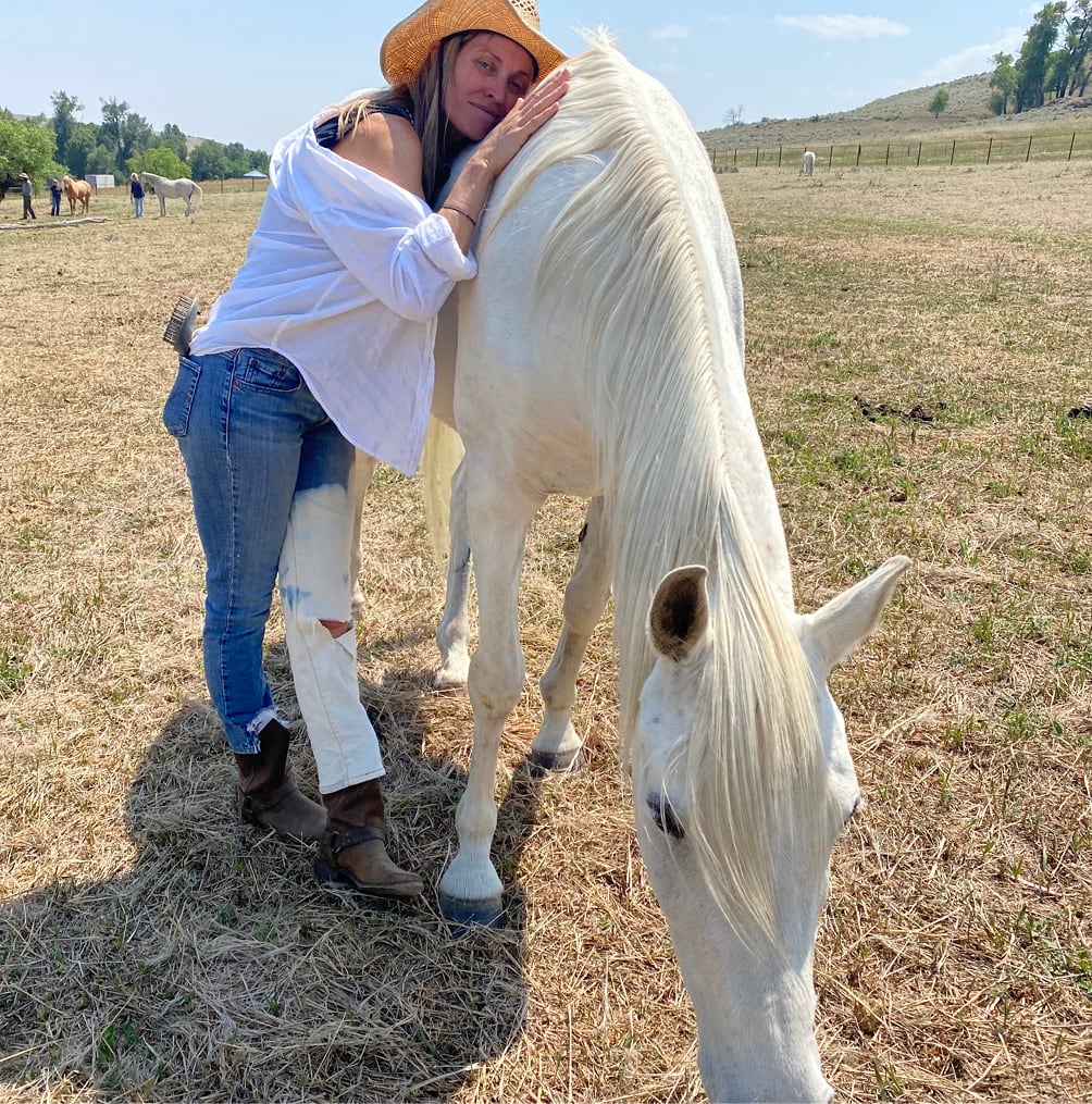 Oniya guest bonding with a horse during their Equine Assisted Learning session