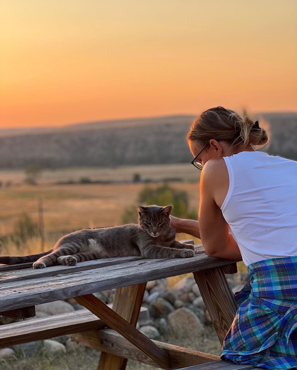 Watching the sunsetl with Otis, the barn cat, at Oniya