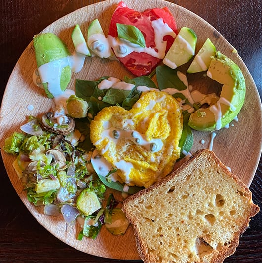an Oniya breakfast: egg avocado, gluten-free toast, greens